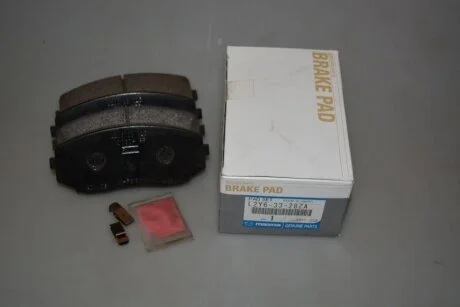 Тормозные колодки передние дисковые MAZDA L2Y63328ZA